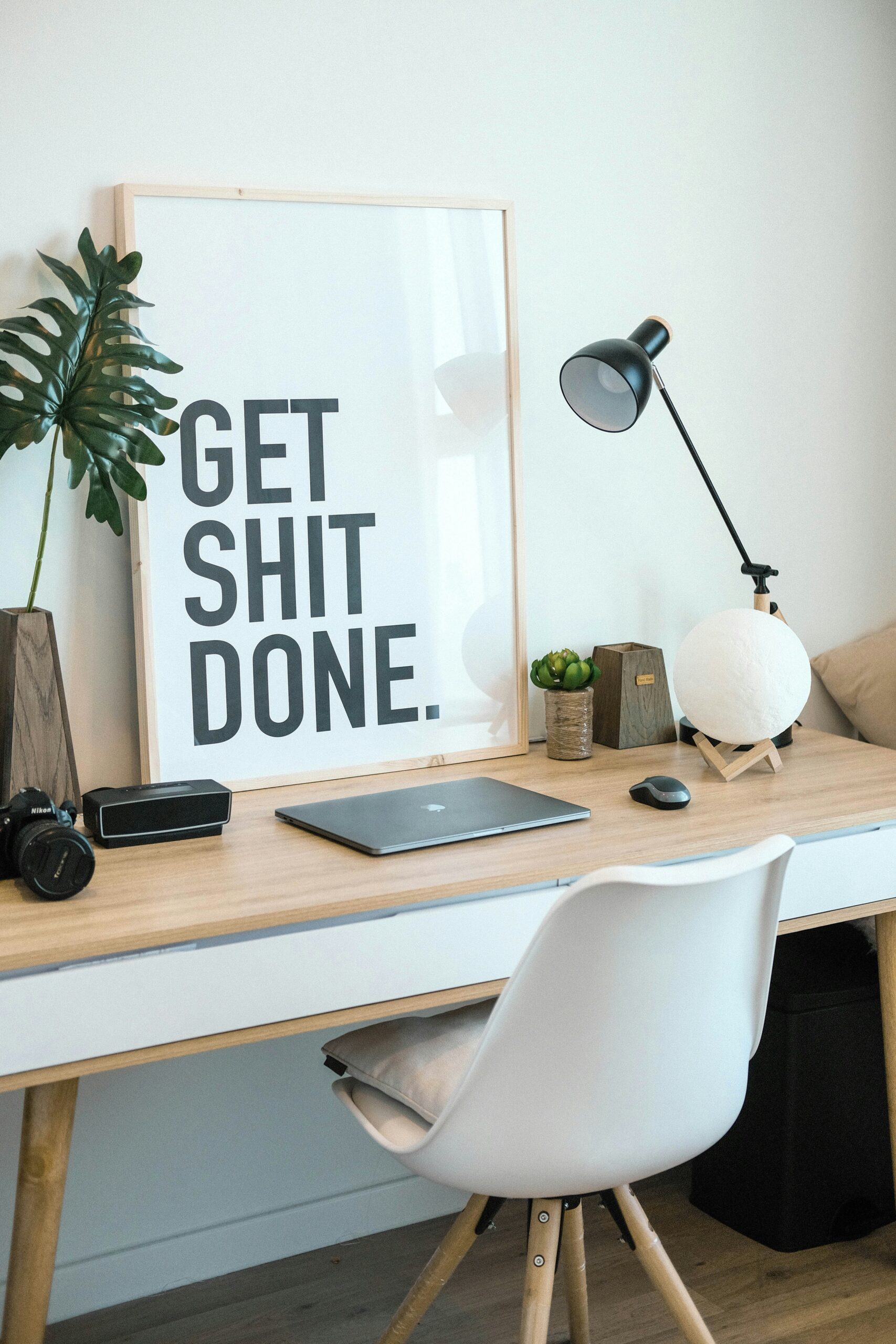 A calm morning workspace with a journal, coffee, and sunlight, symbolizing productivity and mental clarity